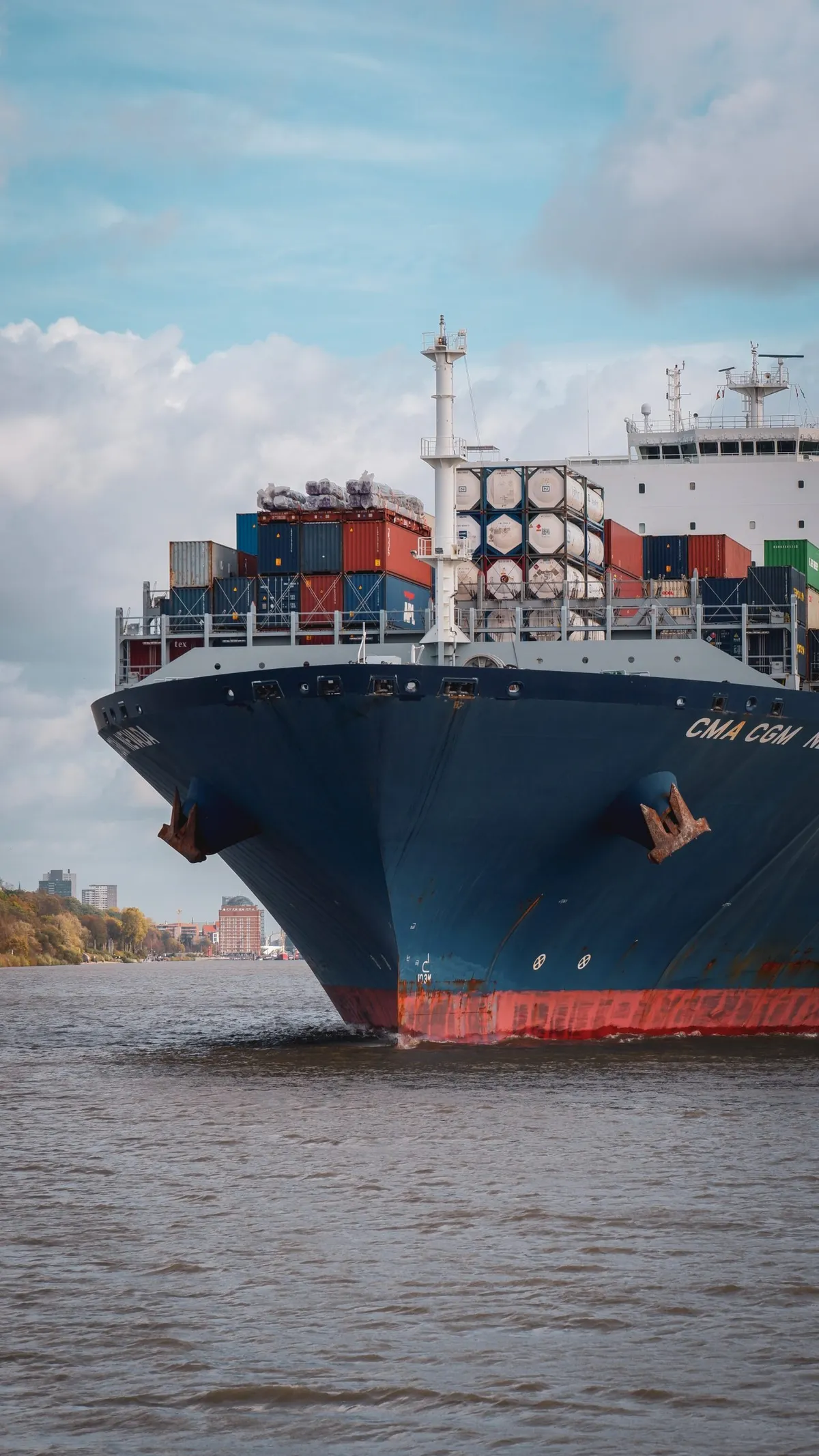 The bow of a container ship at sea.